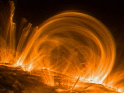 The outermost layer of the <a href="/sun/solar_atmosphere.html&edu=elem">Sun's atmosphere</a> is the <a href="/sun/atmosphere/corona.html&edu=elem">corona</a>.  The corona is very, very hot - about 1 million degrees!  Glowing <a href="/sun/Solar_interior/Sun_layers/Core/plasma_state.html&edu=elem">plasma</a>, which is like magnetized gas, sometimes forms loops in the corona. <a href="/sun/atmosphere/sunspot_magnetism.html&edu=elem">Magnetic fields around sunspots</a> make these loops, called coronal loops. The loops are huge - about 30 Earths would fit across them! A satellite named TRACE took this picture in November 1999.<p><small><em>Image courtesy of NASA/Trace Mission</em></small></p>