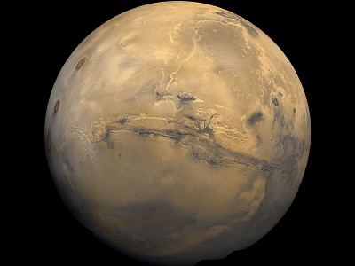The uniquely red <a href="/mars/interior/Martian_global_geology.html&edu=elem">global surface</a> of Mars is marked by many interesting features - some like those on the <a href="/earth/earth.html&edu=elem">Earth</a> and others strangely different. The reddish color is caused by rust (iron oxide) in the <a href="/mars/exploring/martian_soils.html&edu=elem">soil</a>.  Some of these features are; <a href="/mars/interior/mars_volcanoes.html&edu=elem">volcanoes</a>, canyon systems, <a href="/mars/interior/Martian_running_water.html&edu=elem">river beds</a>, <a href="/mars/interior/Mars_cratered_terrain.html&edu=elem">cratered terrain</a>, and <a href="/mars/interior/Martian_dunefields.html&edu=elem">dune fields</a>.  This image shows a global mosaic of 102 Viking 1 Orbiter images of Mars taken in February, 1980.<p><small><em>Image courtesy of NASA.</em></small></p>